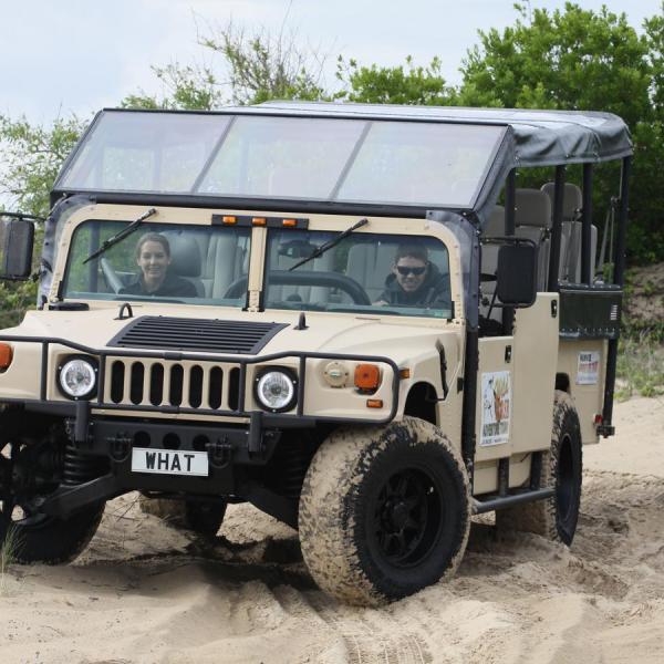 a truck driving down a dirt road