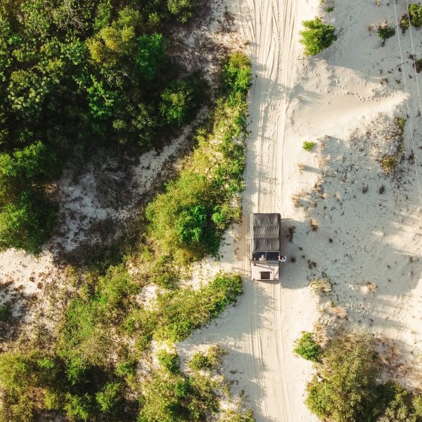 a sign on the side of a river